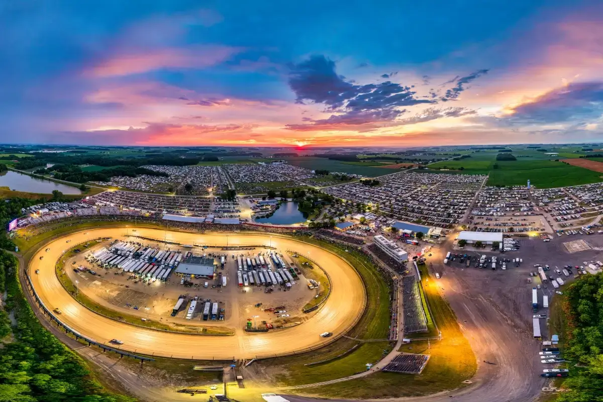 Aerial twilight panorama of Eldora Speedway with grandstands and campgrounds at dusk, Rossburg Ohio