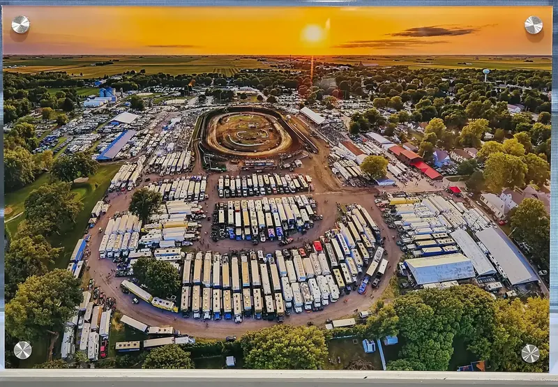 A Prairie Dirt Classic (PDC) aerial photo printed on a floating acrylic panel with corner standoff mounts
